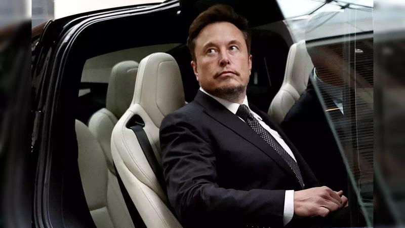 Elon Musk inside a Tesla